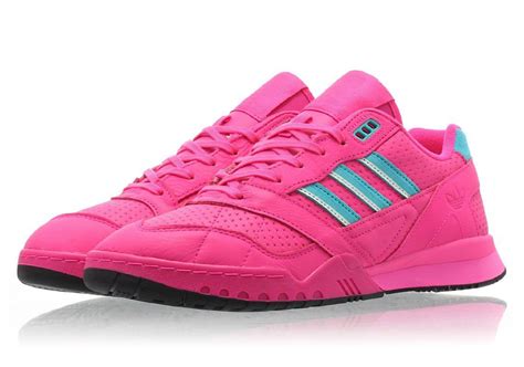 neon pink Adidas sneakers